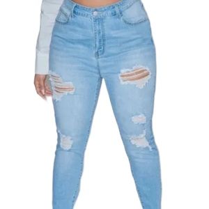 Plus size distressed light washed denim jeans